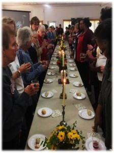 Gathered at Camp Christian around a 40 foot long communion table.